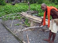 Tomas Taleo Kreno points to the outrigger cross boom.